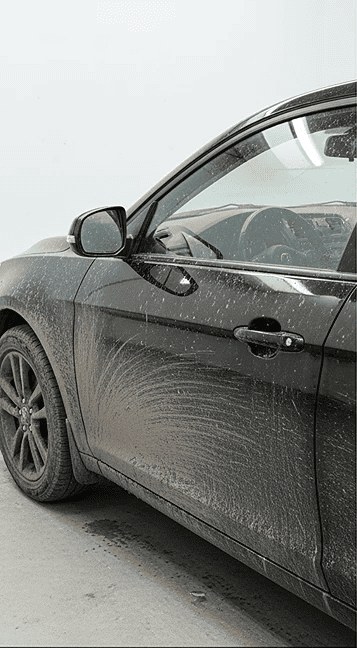 Sedan side before washing — covered in dirt
